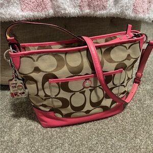 Coach pink and brown tote with shoulder strap.